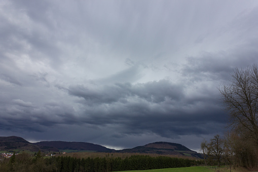 thunderstorm in south germany mountain landscape at easter springtime