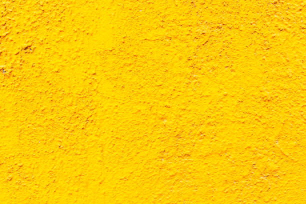 istock Abstract colorful cement wall yellow color. Textures and backgrounds. 942732030
