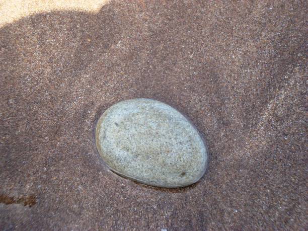 istock PEBBLES IN THE SAND/DARKOUCH BEACH/MOROCCO 942734664
