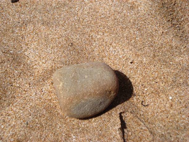 istock PEBBLES IN THE SAND/DARKOUCH BEACH/MOROCCO 942735828