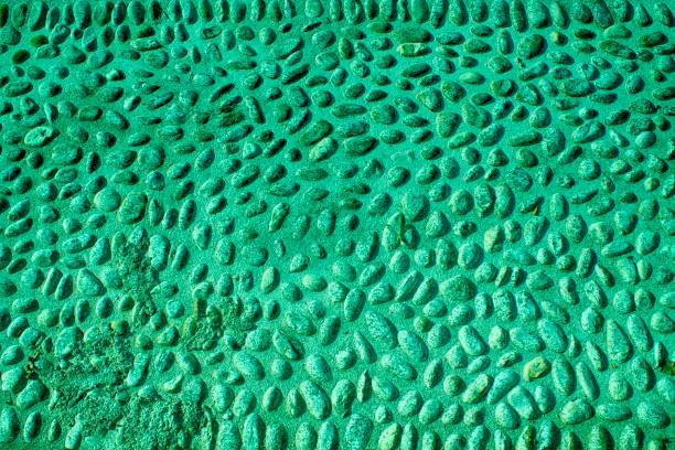 istock Green Nice background image of pebbles, round rocks texture 942736688