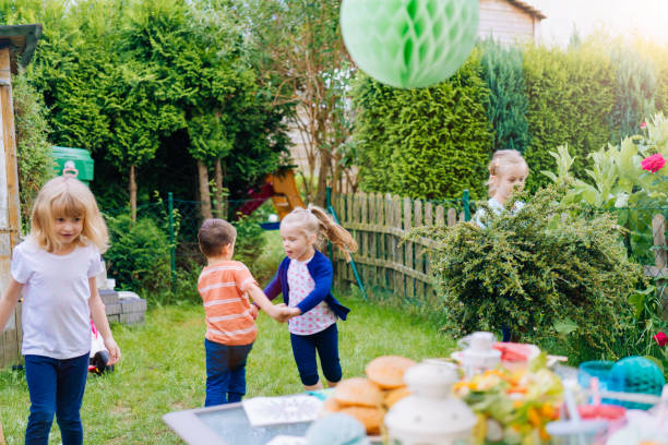 istock Cute Kids Having Fun Outside for Summer Backyard Party 942737922
