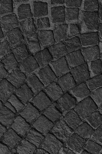 istock Street pavement background, rock texture 942739916