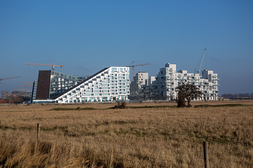 Newly developed area of Copenhagen - Oerestad - with fields and modern architecture.