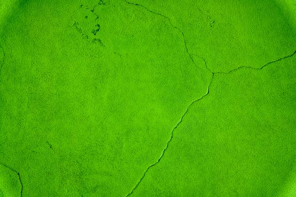 istock Golden lime colored Old orange grungy cement texture, grey concrete wall background for web site or mobile devices 942740738
