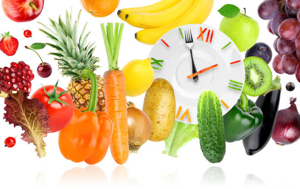 istock Food clock with fruits and vegetables 942743962