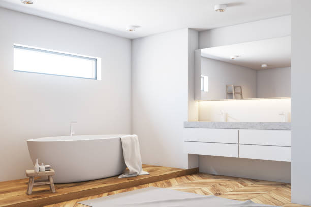 istock White bathroom corner, white tub, wood 942744466