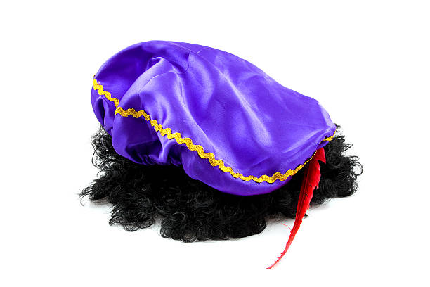 hat with red feather and black hair of Zwarte Piet  zwarte piet stock pictures, royalty-free photos & images