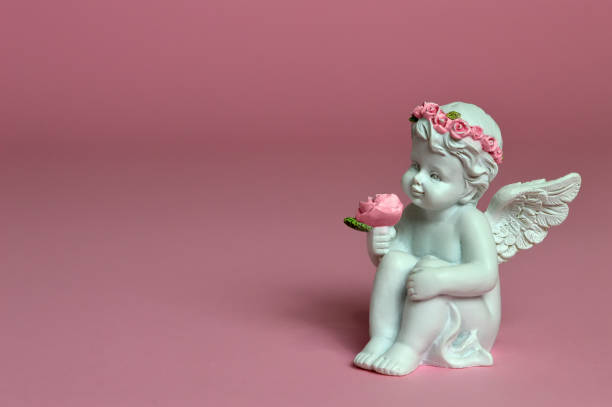 istock Angel holding flowers 942746878