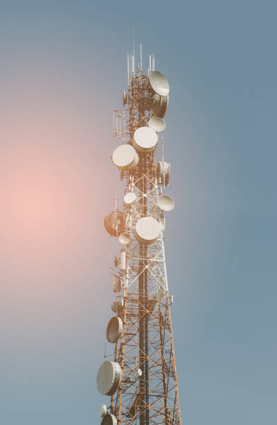 istock Telecommunication tower with antennas with blue sky 942747044