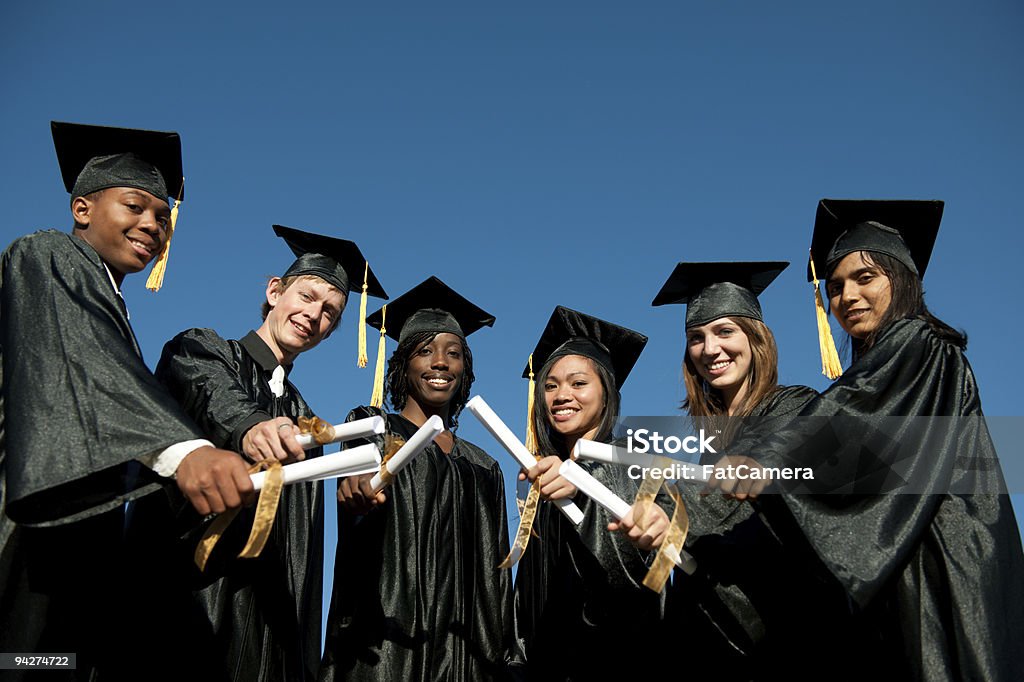 Graduation A multi ethnic group of graduates in graduation gowns. 20-24 Years Stock Photo