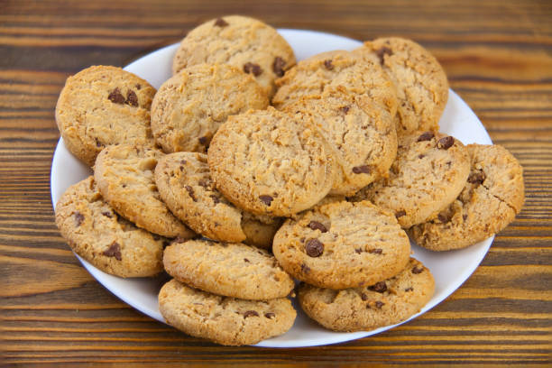 istock delicious appetizing cookies with chocolate on plate 942747906