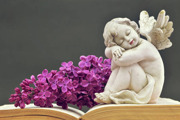 istock Condolence card with angel and spring flower 942748232