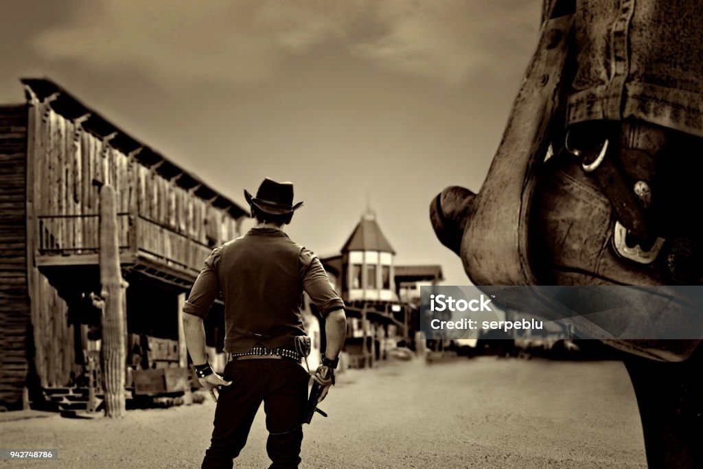 vintage cowboy western sheriff in old wild west ghost town Wild West Stock Photo