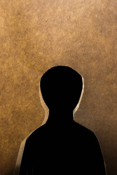 istock Man shape cut out of paper in hand 942751624