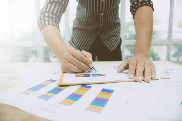 istock Image of human hands pointing at paper during explanation 942751688