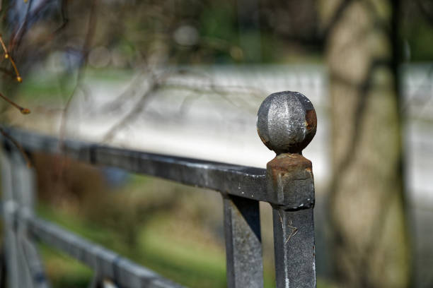 Fence in public park, safety access in entrance.