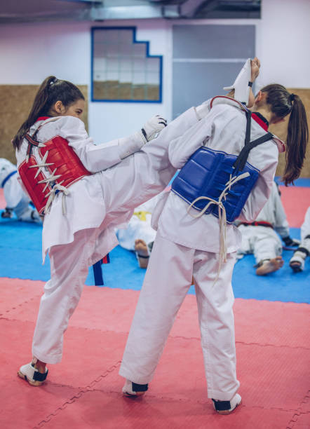 istock Young girls on taekwondo training 942752470