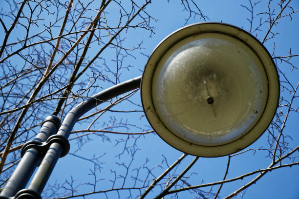istock Street lantern in sunny day, turned off, urban background 942756286