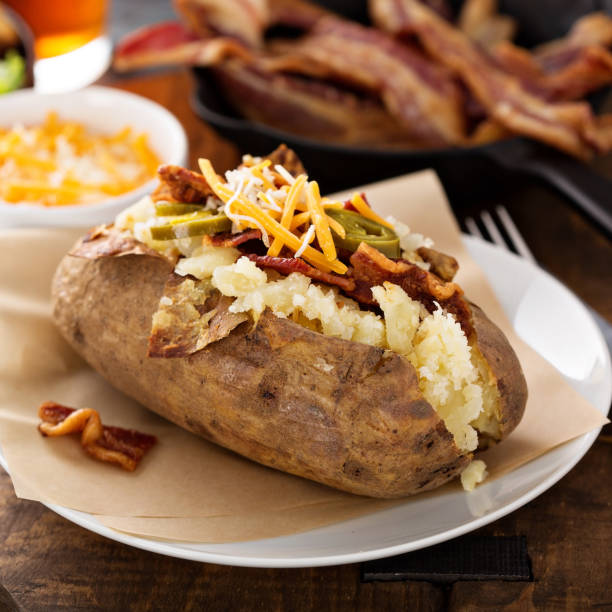 istock Loaded baked potato with bacon and cheese 942756594