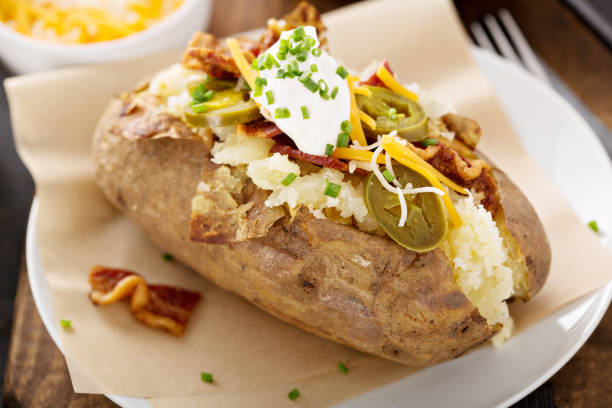 istock Loaded baked potato with bacon and cheese 942759172