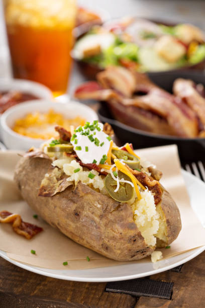istock Loaded baked potato with bacon and cheese 942759480
