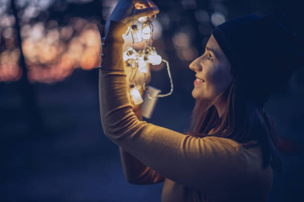 istock Pretty woman with light 942760158