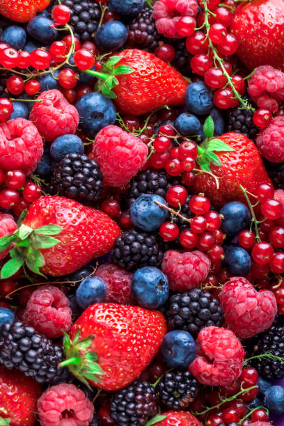 istock Berries fresh colorful overhead assortment strawberries blackberries red currant raspberries 942762536
