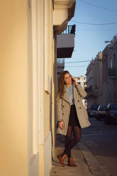 istock Serious woman is talking on the phone 942774402