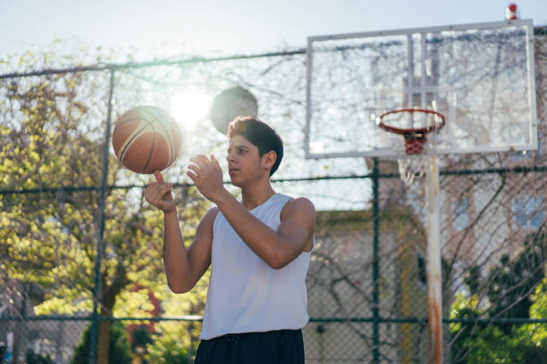 istock Streetball player showing his skill 942785462