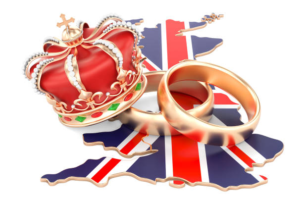 istock Royal wedding concept. Wedding rings with royal crown on the British map, 3D rendering 942799642