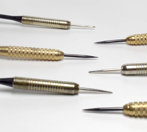 Darts needles. Sharp Steel. Brass and stainless barrels. Closeup. Square frame