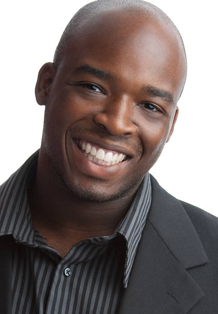 istock Young black man in business suit with white background 94280640