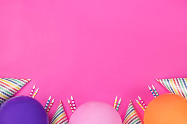 istock Birthday party composition on pink background. Top view with copy space. 942809292