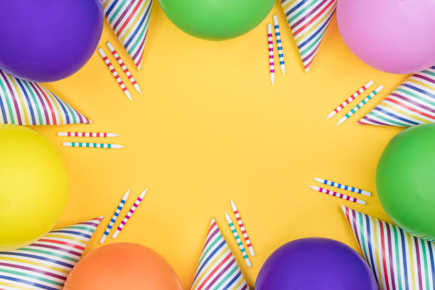 istock Birthday party composition on yellow background. Top view with copy space. 942809310