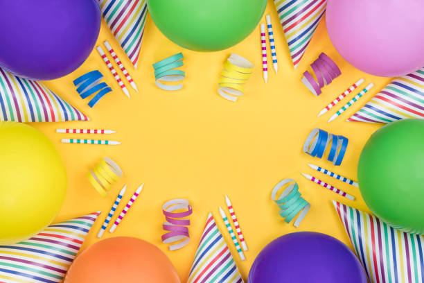 istock Birthday party composition on yellow background. Top view with copy space. 942809312