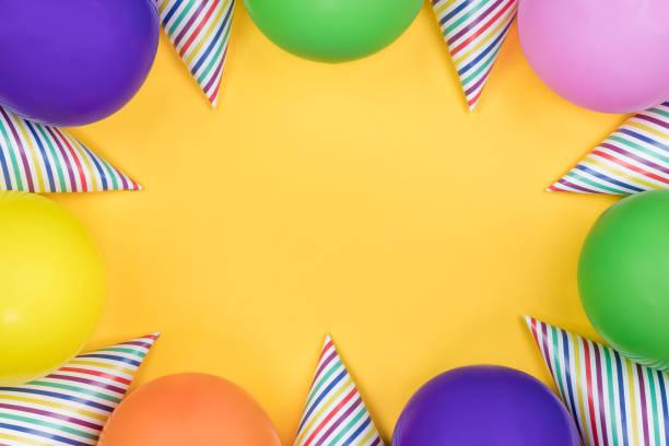 istock Birthday party composition on yellow background. Top view with copy space. 942809360