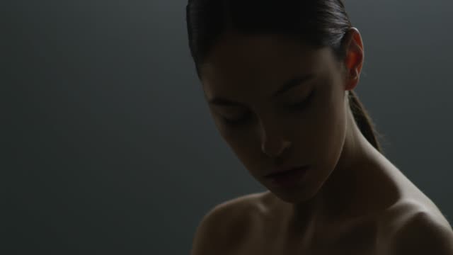 Beautiful female face closeup. Fashion video. Slow motion. 4K 30fps ProRes 4444