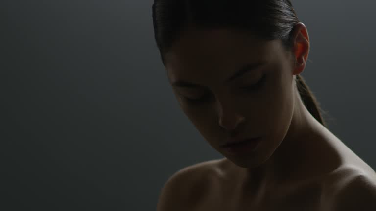 Beautiful female face closeup. Fashion video. Slow motion. 4K 30fps ProRes 4444