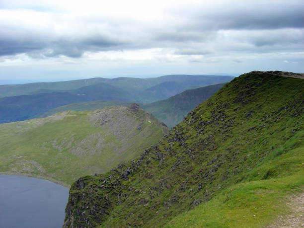 Striding Edge, Helvellyn, Cumbria UK Looking Down Towards Striding Edge, from the Summit of Helvellyn striding edge stock pictures, royalty-free photos & images