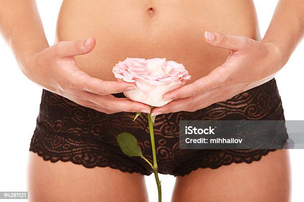 Young Woman Holding Rose In Front Of Vagina Maroon Panties Stock Photo - Download Image Now