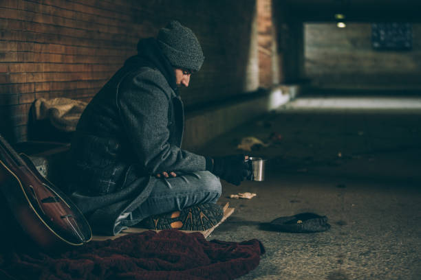 istock Pleading for money on the street 942815880