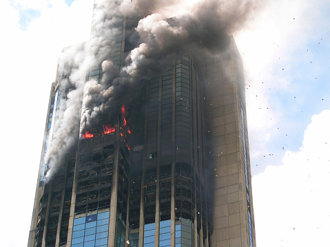 Skyscraper building on blazing fire