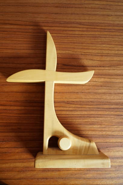 istock The cross on a wooden desk 942825554
