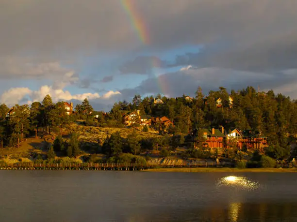 A rainbow appears over the lake in this image shot at Big Bear. This southern California mountain resort located in the San Bernardino mountain famed for its skiing.