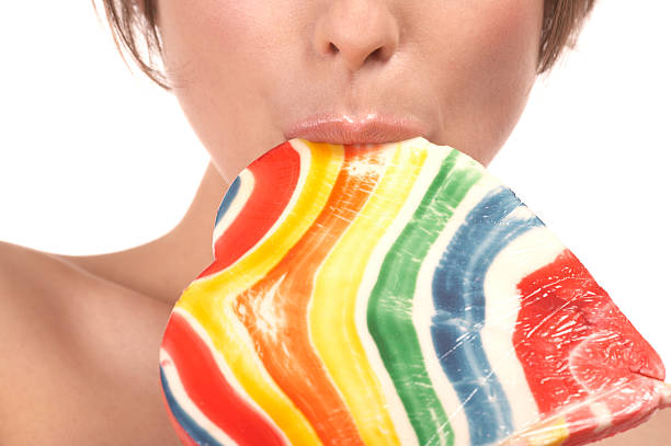 istock Girl licking lollipop 94282633