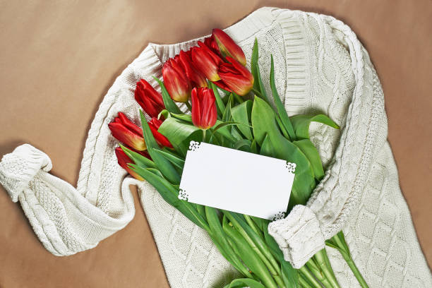 istock Tulips as a gift on a sweater (space for text) 942826792