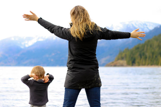 istock Mother and Child at Beach Playing 942836324