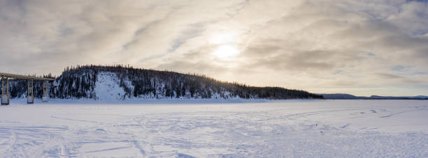 low sun above Yukon River The sun was getting low above the frozen Yukon River frozen river stock pictures, royalty-free photos & images