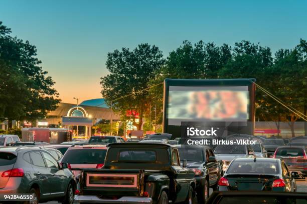Watching Movies Outdoors From The Car In The City Parking Lot Stock Photo - Download Image Now